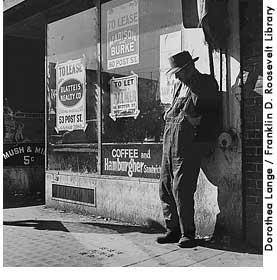 [picture: destitute man leaning against vacant store, 1935]