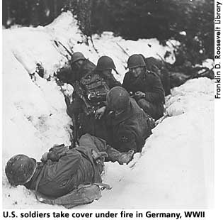 [picture: U.S. soldiers take cover under fire in Germany, World War II]  