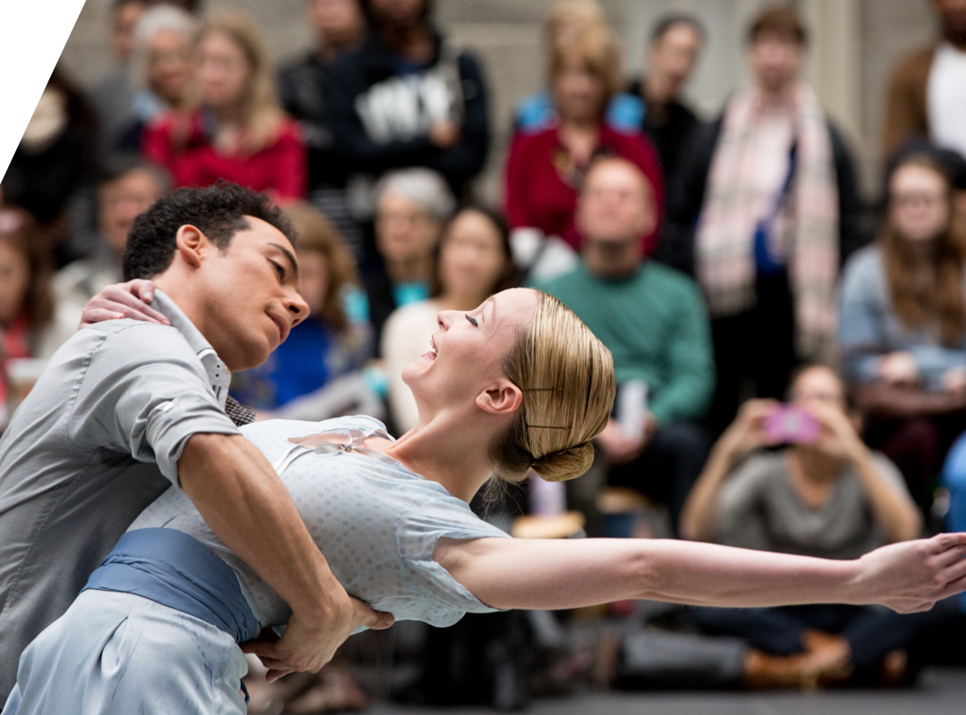 two students dancing on stage