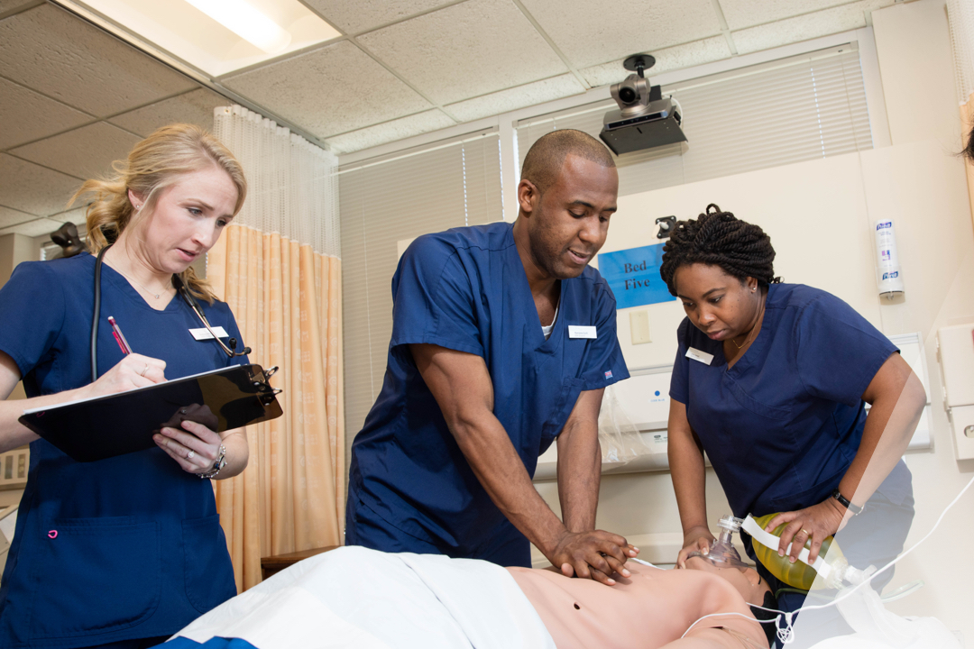 Nursing students with a dummy