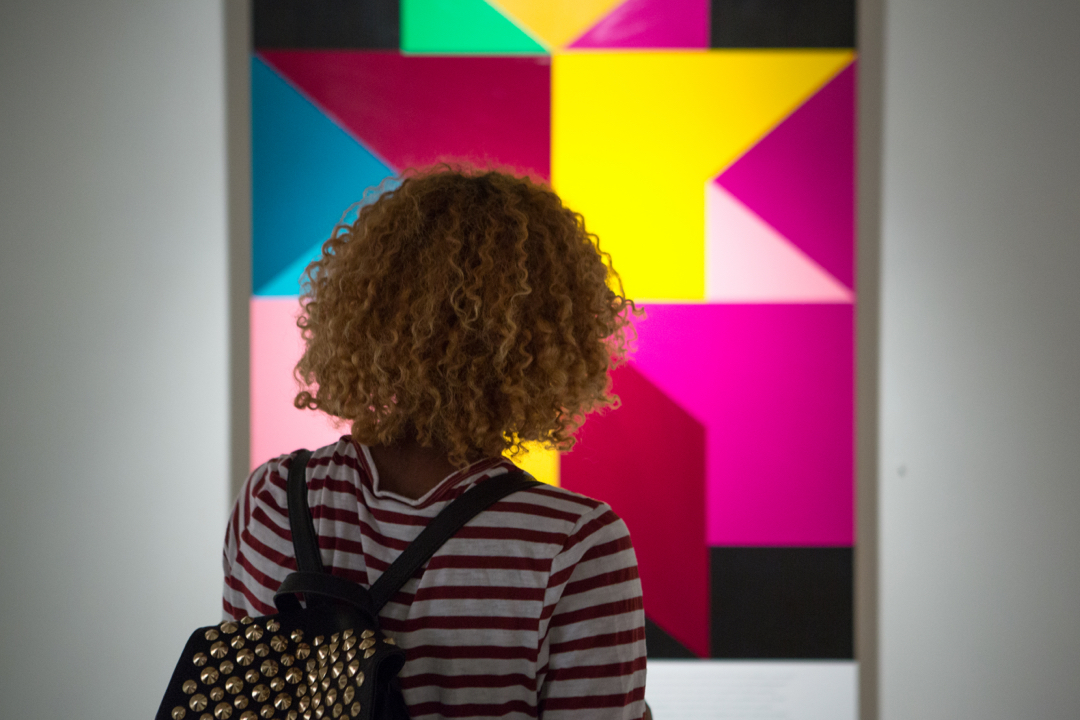 Student looking at art