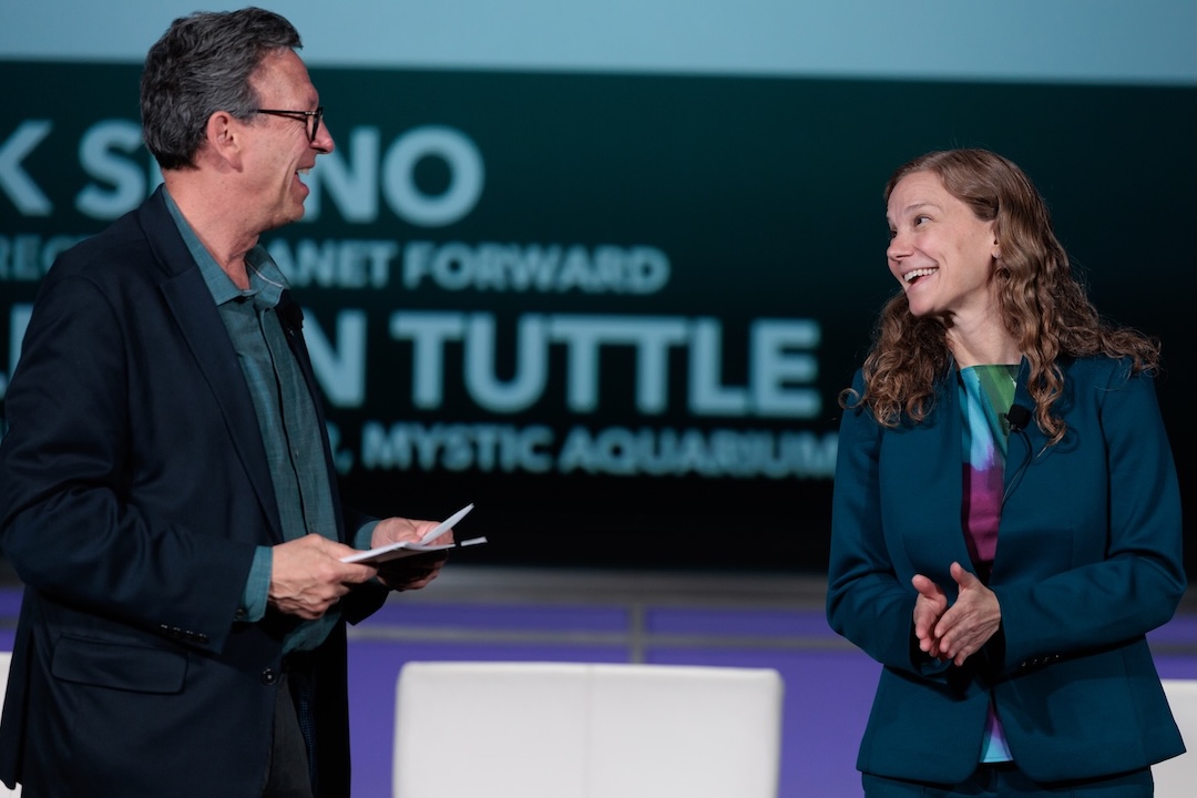  Frank Sesno and Allison D. Tuttle on stage at Planet Forward Summit