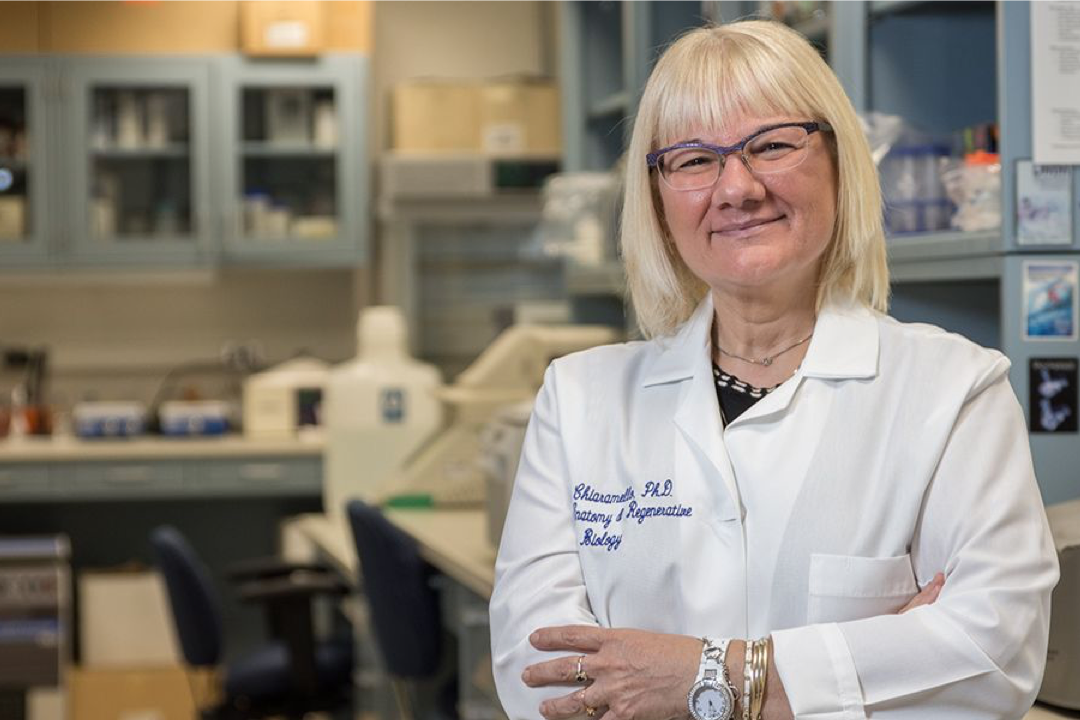 Dr. Chiaramello in a lab coat