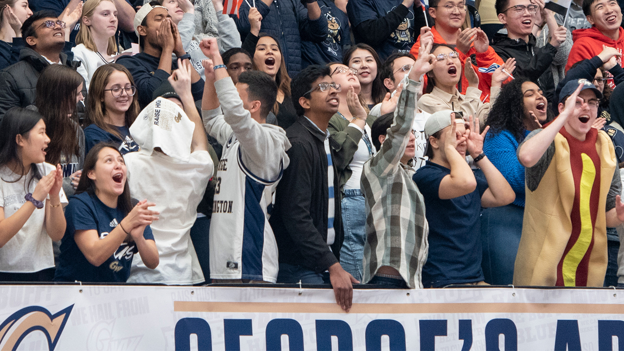 Students cheering at basketball game