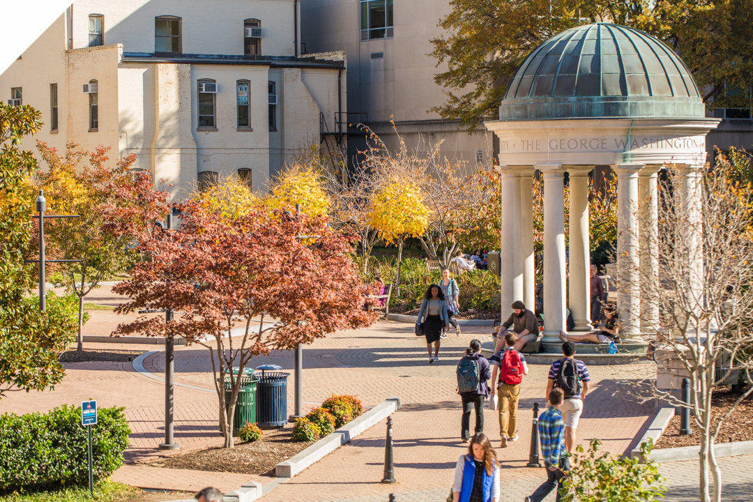 Kogan Plaza tempietto with students walking through and the leaves changing colors during the Autumn season