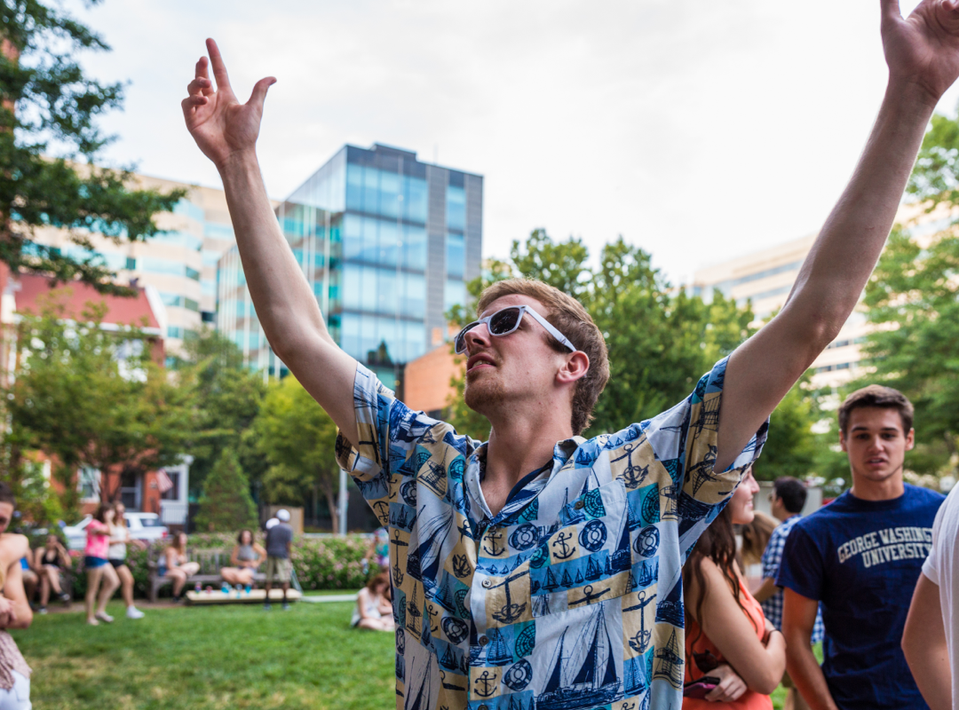 student celebrating on campus
